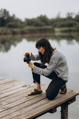 female photographer on nature background