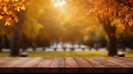 Naklejka na ściany i meble Empty wooden table top with blur background of autumn trees garden