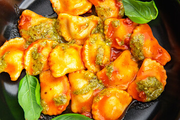 ravioli pesto sauce, tomato sauce meat pasta meal food snack on the table copy space food background rustic top view