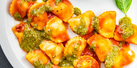ravioli pesto sauce, tomato sauce meat pasta meal food snack on the table copy space food background rustic top view