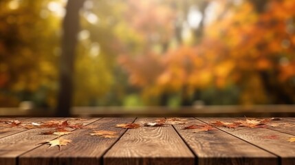 Naklejka na ściany i meble Empty wooden table top with blur autumn leaves background