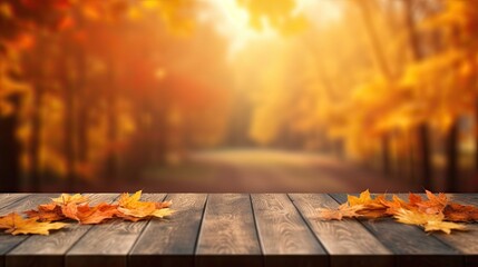 Naklejka na ściany i meble Empty wooden table top with blur autumn leaves background