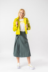 Woman in stylish youth casual skirt, leather jacket and white t-shirt
