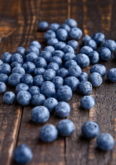 Blueberries on grunge wooden kitchen board. Natural healthy food. Still life photography
