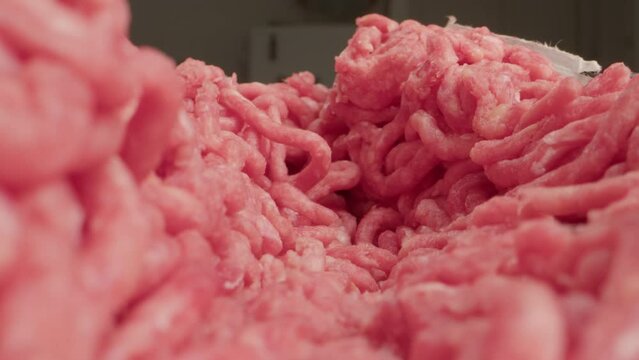 Raw minced meat macro probe lens, beef or pork red minced burger meat, close up tunnel rotation.
