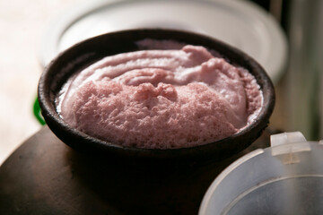 Preparation in clay pots of chicha morada, a fermented drink native to Peru.