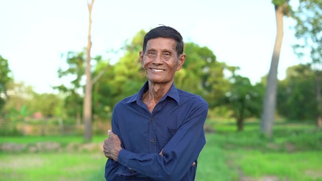 Slow motion scene  Asian thin body elderly man happy smile at you outdoor