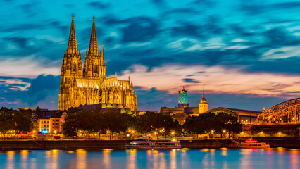 Fototapeta premium Cologne Koln Germany during sunset, Cologne bridge with the cathedral. beautiful sunset at the Rhine river
