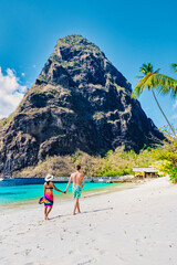 couple walking on the beach during summer vacation on a sunny day, men and woman on vacation at the...