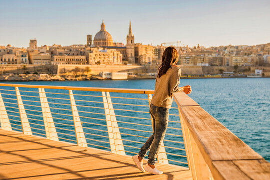 Valletta Malta city Skyline, colorful house balcony Malta Valletta city, young Asian woman visit Malta during a vacation