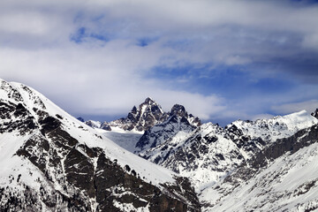 Snow mountain in sun winter day, view from ski slope. Caucasus Mountains. Svaneti region of Georgia.