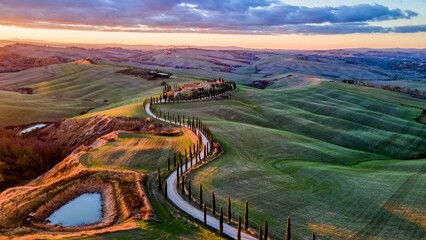 The hills of Tuscany near Siena, with a road of cypress trees