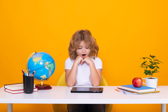 School child portrait isolated on yellow studio background. Kid boy from elementary school. Pupil go study. Clever schoolboy learning. Kids study, knowledge and education.