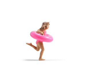Little girl running with a pink rubber swimming ring