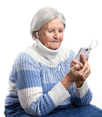 Senior woman listening to music or watching video on smartphone