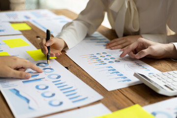 Business meeting, brainstorming discuss analysis of business market growth charts for strategic planning and investment. Cooperation and collaboration of people in the organization.