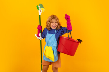 Cleaning house. Studio isolated portrait of child mopping house, cleaning home. Detergents and...
