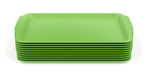 Group of green plastic trays on white background