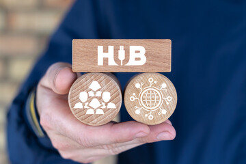 Man holding wooden blocks sees text: HUB. Web digital networking. Hub Network Connection Technology.