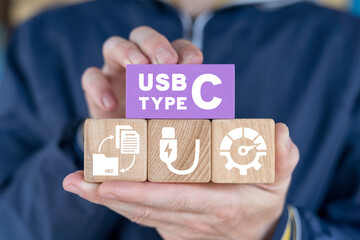 Man holding colorful blocks sees inscription: USB TYPE C. Concept of USB type C port cable. USB type С technology integration.