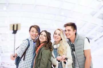 Naklejka na ściany i meble Youth makes selfie at the airport