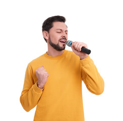 Handsome man with microphone singing on white background