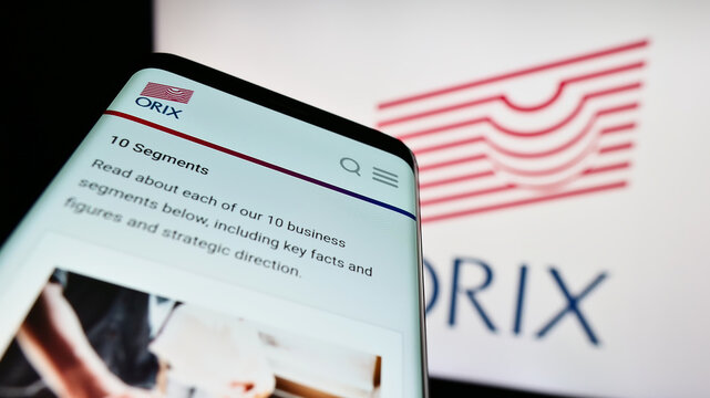Stuttgart, Germany - 07-01-2023: Smartphone with website of Japanese financial company ORIX Corporation on screen in front of business logo. Focus on top-left of phone display.