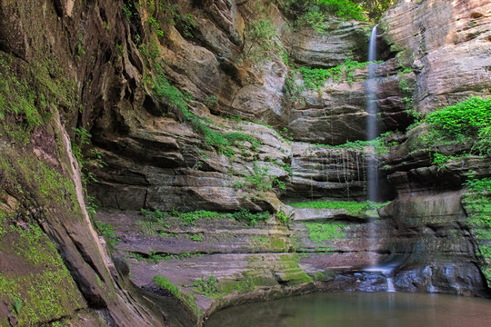 After a precipitous plunge, the waterfall at Wildcat Canyon gently fills a a pool of water at the base of the canyon.  Mist from the falls stimulates the growth of a soft green moss and dangling ivy o