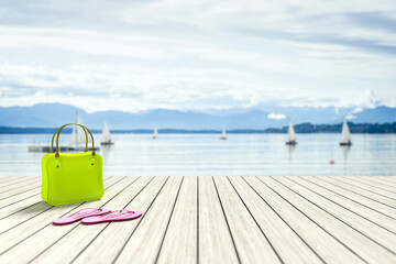3d rendering of a green bag on a wooden jetty with sailing boats in the background
