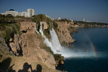 Beautiful view of the waterfall that flows into the sea.