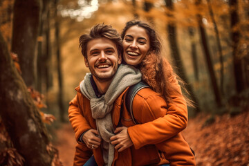 Happy couple piggybacking in a forest one autumn afternoon - Powered by Adobe