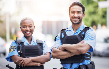 Happy, portrait and police with arms crossed in the city for security, safety and justice on the...