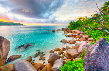 Beautiful sunset over the famous beach Anse Lazio, Praslin island, Seychelles.