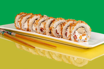 Sushi sets, rolls with caviar, shrimp, tuna and avocado and Philadelphia cheese, on a white plate.