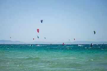 Kitesurfing on Valdevaqueros beach, Gibraltar Strait in Tarifa, Spain on June 17, 2023
