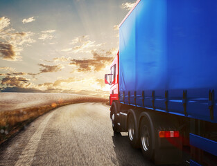 Blue truck on the road with the landscape at sunset  . 3D Rendering