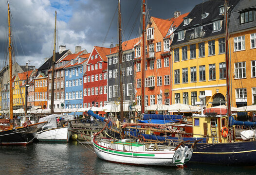 Yacht and color houses in seafront Nyhavn (new Harbor) in Copenhagen, Denmark