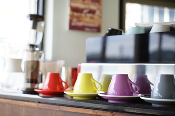 Fototapeta na wymiar Colorful coffee cup in a coffee shop