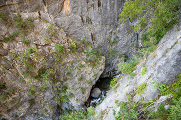 Fast flowing water in Sapadere canyon with rocks and stones in the Taurus mountains near Alanya, Turkey