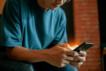 Succeed at work. Asian businessman working on computer laptop and chatting on smartphone at work. work from home and successful concept