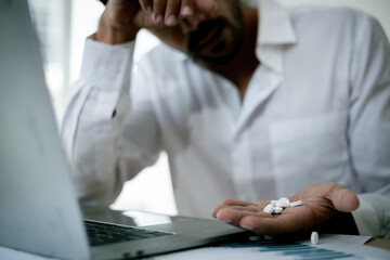 Tired business man working at home Stressed man at work. Tired from work. Accumulated stress at...