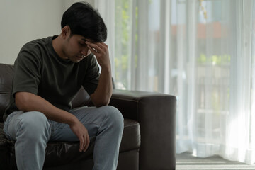 Depression and mental illness. Asian man disappoint, sad after receive bad news. Stressed boy confused with unhappy problem, arguing with girlfriend, cry and worry about unexpected work, down economy.