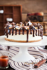 Delicious two-ply chocolate cheesecake decorated with candies and frosting