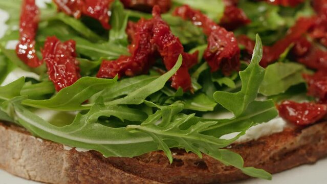 American pastrami sandwich in New York ham meet cuts. chef cooking Famous thick cut sous vide beef sandwich on restaurant cafe kitchen. Bread with curd cheese. Studio shot close up.