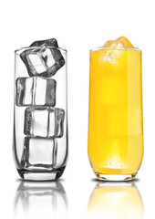 Glass of orange soda with ice cubes empty glass and bubbles with reflection on white background