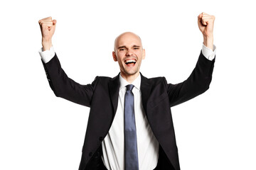 Studio shot of a young man who raises his hands in a gesture of victory.