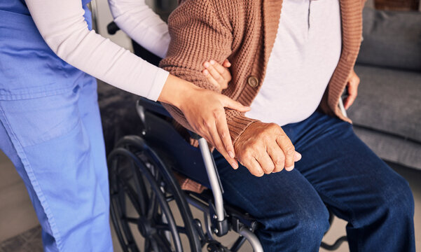 Hands, nurse and patient in wheelchair for support, medical service and physical therapy in retirement home. Closeup of caregiver helping elderly person with disability, healthcare and nursing aid
