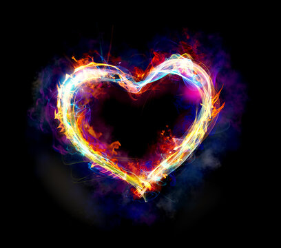 Heart with colourful light motion and fire on dark background