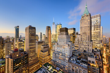 New York City Financial District cityscape at dusk.