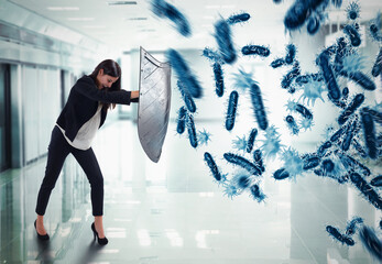 3D Rendering. woman protects with the shield by an attack of bacteria